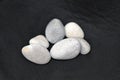 Gray pebbles on black Royalty Free Stock Photo