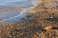 Pebbles mixed with sand of the beautiful Skala beach, Kefalonia island, Ionian sea, Greece Royalty Free Stock Photo