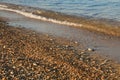 Pebbles mixed with sand of the beautiful Skala beach, Kefalonia island, Ionian sea, Greece Royalty Free Stock Photo