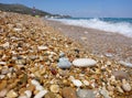 Pebbles mixed with sand of the beautiful Skala beach, Kefalonia island, Ionian sea, Greece Royalty Free Stock Photo