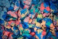 Pebbles painted colored paints in bright Royalty Free Stock Photo