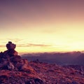 Pebbles pyramid. Stones on Apine gravel mountain summit. Daybreak horizon Royalty Free Stock Photo