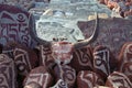Pebbles from sacred Lake Manasarovar with hieroglyphs and main Buddhist mantra `Om Mani Padme Hum`. Royalty Free Stock Photo