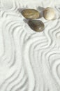 Pebbles in the sand, a background of appeasement Royalty Free Stock Photo