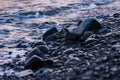 Pebbles on the sea shore at sunset