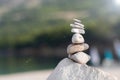 Pebbles stack balance over blue Adriatic sea in Croatia. Tower of stones Royalty Free Stock Photo