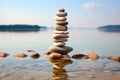 pebbles stacked into a balancing tower on a peaceful beach