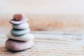 Pebbles stacked on a wooden background - Atmosphere of serenity