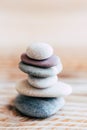 Pebbles stacked on a wooden background - Atmosphere of serenity