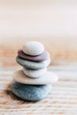 Pebbles stacked on a wooden background - Atmosphere of serenity