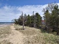 Pebbles stones Sky clouds Water lake sandy beach relaxing scenic Royalty Free Stock Photo