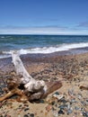 Pebbles stones Sky clouds Water lake sandy beach relaxing scenic Royalty Free Stock Photo