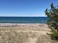 Pebbles stones Sky clouds Water lake sandy beach relaxing scenic Royalty Free Stock Photo