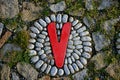 pebbles stuck in cement glue. it forms a carpet of rounded stones. massage