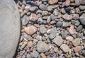 Pebbles texture. Colorful stones on the ground. Top view of Natural gravel on the summer beach. Stone with copy space