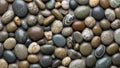 Pebbles in various sizes and colors including shades of gray brown Royalty Free Stock Photo