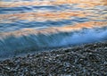 Pebbles and the waves at sunset