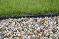 Pebblestones and green grass Royalty Free Stock Photo