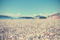 Pebbly beach on a sunny summer day, retro/vintage Royalty Free Stock Photo