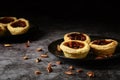 Pecan butter tarts on a grey plate