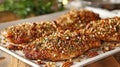 Pecan-crusted chicken breasts on a white serving platter