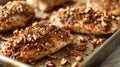 Pecan-crusted chicken breasts on a white serving platter