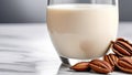 Pecan nut milk in a glass on a table Royalty Free Stock Photo