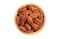 Pecan nuts in bamboo bowl isolated on white background. Top down view Royalty Free Stock Photo