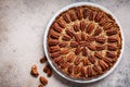 Pecan Pie on white dish, gray-brown background, top view. Vegan dessert concept Royalty Free Stock Photo