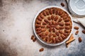 Pecan Pie on white dish, gray-brown background, top view. Vegan dessert concept Royalty Free Stock Photo