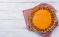 Pecan, Pumpkin, Thanksgiving Holiday Pies on a rustic table with decorative gourds. Top view