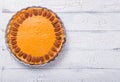 Pecan, Pumpkin, Thanksgiving Holiday Pies on a rustic table with decorative gourds. Top view