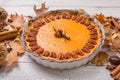 Pecan, Pumpkin, Thanksgiving Holiday Pies on a rustic table with decorative gourds. Top view