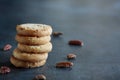 Pecan Sandies Cookies Stacked on a Dark Background