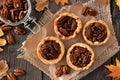 Pecan tarts above scene on rustic wood Royalty Free Stock Photo