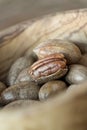 Pecans Carya illinoinensis in a wooden bowl Royalty Free Stock Photo