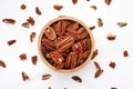 Pecans in wood bowl on white background