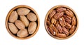 Pecans, in their shells and shelled nut halves, in wooden bowls Royalty Free Stock Photo