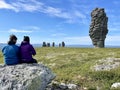 Pechora-Ilych Nature Reserve, Northern Ural, Russia, July, 12, 2021.People looking for stone pillars of weathering on the Manpupun