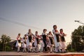 PECINCI, SERBIA - JULY 15, 2023: group of children, boys and girls dancing a Serbian kolo in Pecicni, serbia. Srpsko kolo is a Royalty Free Stock Photo
