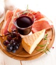 Pecorino Toscano and dry cured ham with red wine Royalty Free Stock Photo