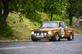 Vintage rally cars speeding across the city