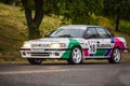 Vintage rally cars speeding across the city