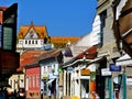 popular narrow shopping alley in Pecs, Hungary. colorful signage and old architecture.