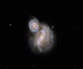 Peculiar spiral galaxies IC 4271 Arp 40. Elements of this picture furnished by NASA