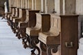 Peculiar vintage pianos collection aligned in bright monastery cloisters Royalty Free Stock Photo