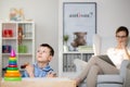 Pedagogue observes boy sick of Haller`s syndrome Royalty Free Stock Photo