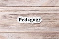 PEDAGOGY of the word on paper. concept. Words of PEDAGOGY on a wooden background Royalty Free Stock Photo