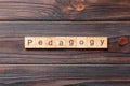 Pedagogy word written on wood block. Pedagogy text on cement table for your desing, concept Royalty Free Stock Photo