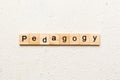 Pedagogy word written on wood block. Pedagogy text on cement table for your desing, concept Royalty Free Stock Photo